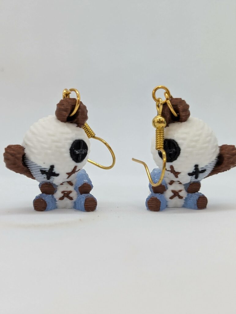 Tiny Teddy bear earrings with blue glow accents